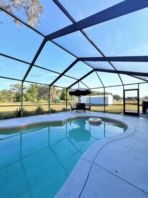 Outdoor pool, a heated pool - 4BR/3BA Family & Pet-Friendly Oasis Near Downtown (Lakeland)