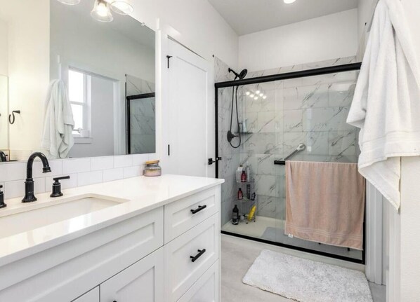 Shower, hair dryer, towels, soap