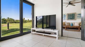 Deluxe Apartment | Living area | 32-inch Smart TV with digital channels