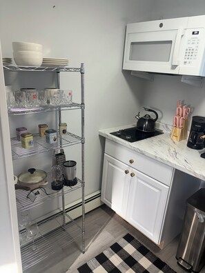Fridge, microwave, stovetop, coffee/tea maker