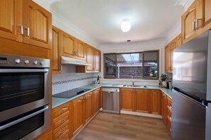 Fridge, microwave, oven, stovetop - Pearl: Fresh, stylish, renovated beach house. Easy walk to Jervis Bay's beaches (Vincentia)
