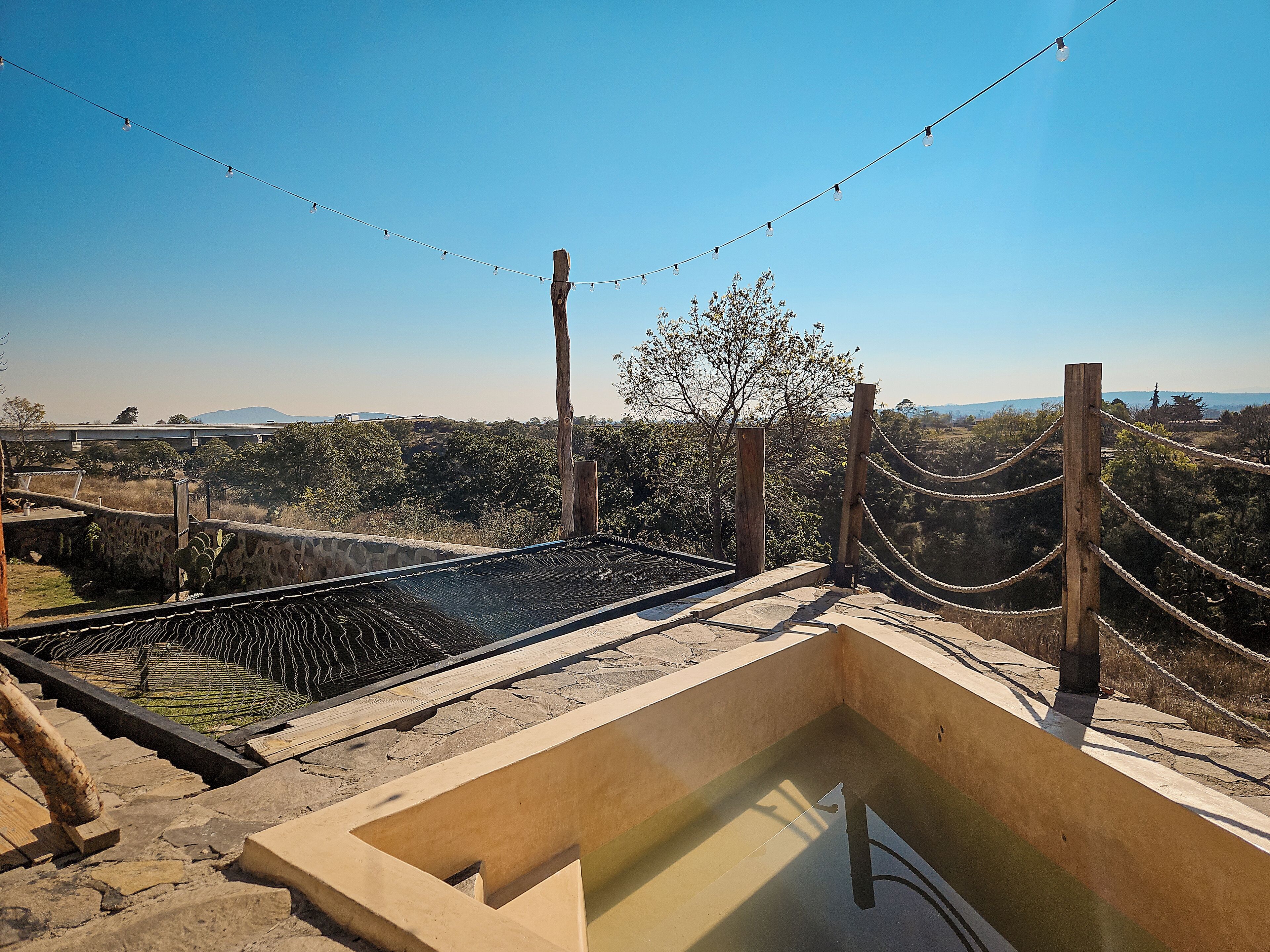 Habitación cuádruple Deluxe, patio, vista al jardín | Alberca privada