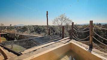 Habitación cuádruple Deluxe, patio, vista al jardín | Alberca privada