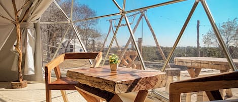 Deluxe Quadruple Room, Patio, Garden View | Living area