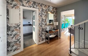 A modern kitchen with white cabinets, a black countertop, and a white sink. - Gorgeous home in Torre de Benagalbon with outdoor swimming pool (Torre de Benagalbon)