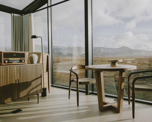 Glass lodge with private hot tub & sauna near Seljalandsfoss