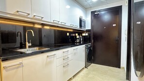 Fridge, stovetop, electric kettle, toaster - Cozy & Stylish Studio in DSO (Dubai)