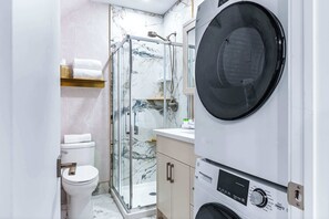 Shower, hair dryer, towels, soap