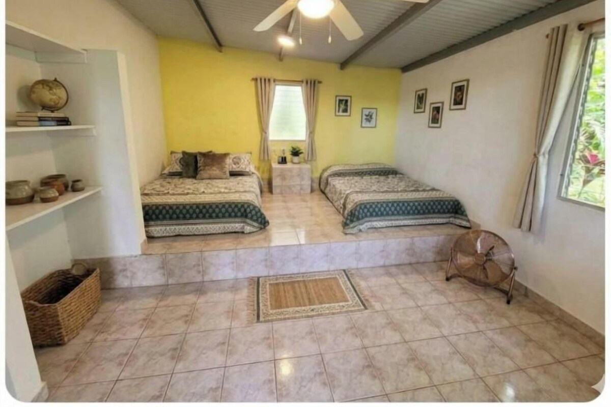 Basic quadruple room, shared bathroom, fan, and ocean view | WiFi (free), bed sheets