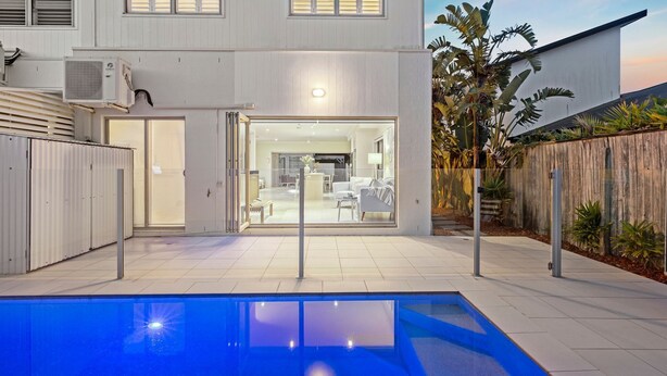 A modern house with a swimming pool, a patio, and a view of the backyard. - Casa Casuarina - Private pool & steps to the beach (Casuarina)