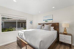 1 bedroom, desk, iron/ironing board, travel crib