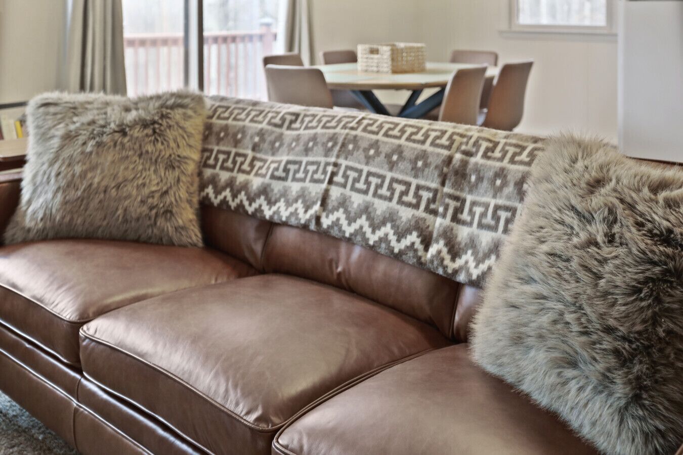 Full grain leather couch with alpaca throw.