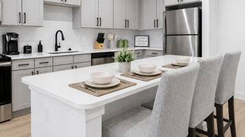 Coffee/tea maker, fridge, microwave, oven