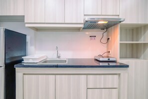 Standard Apartment, 1 Bedroom | Private kitchen - Fully Furnished With Cozy Design Studio Azalea Suites Apartment (Cikarang)