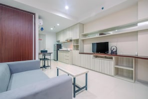 Living area - Fully Furnished With Cozy Design Studio Azalea Suites Apartment (Cikarang)
