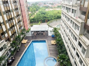 Outdoor pool - Homey Studio At Lrt City Jatibening Apartment (Bekasi)