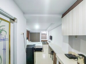 Standard Studio, 1 Bedroom | Private kitchen - Homey Studio Apartment At Mansyur Residence (Medan)