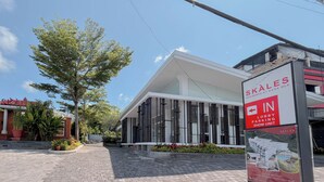 A modern building with a sign indicating a lobby parking show unit. - Pleasant And Stylish 2Br (No Kitchen) At Skales Residence Nusa Dua Bali (Nusa Dua)