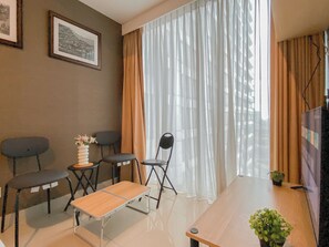 Living area - Cozy Stay 1Br At Apartment Grand Kamala Lagoon (Bekasi)