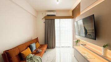 Apartamento standard, 2 quartos | Área de estar