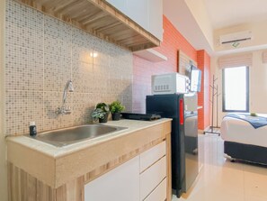 Standard Studio, 1 Bedroom | Private kitchen - Minimalist And Homey Studio At Apartment Evenciio Margonda (Depok)