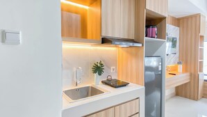 Standard Studio, 1 Bedroom | Private kitchen - Cozy White Studio At Pollux Chadstone Apartment (Cikarang)
