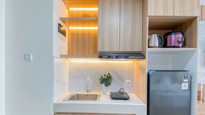 Standard Studio, 1 Bedroom | Private kitchen - Cozy White Studio At Pollux Chadstone Apartment (Cikarang)