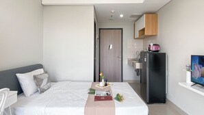 Unclassified image, 4 of 17, button - Cozy Warm Tone Studio At Monroe Tower Apartment (Cikarang)