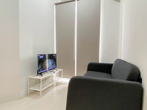 Standard Apartment, 1 Bedroom | Living area - Comfy And Trendy 1Br At Vasanta Innopark Apartment (Cikarang)