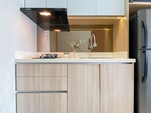 Standard Studio, 1 Bedroom | Private kitchen - Cozy And Pleasant Living Studio At Apartment Oasis Cikarang (Cikarang)