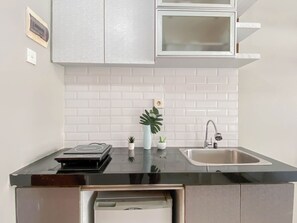 Standard Studio, 1 Bedroom | Private kitchen - Cozy Living Studio At Apartment Taman Melati Margonda (Depok)