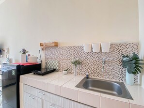 Standard Studio, 1 Bedroom | Private kitchen - Cozy And Neat Studio At Dave Apartment (Depok)