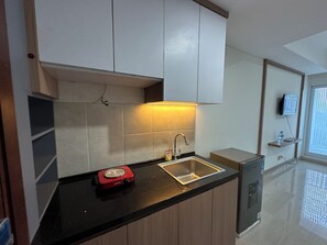 Standard Studio, 1 Bedroom | Private kitchen - Comfy And Warm Studio At Grand Sungkono Lagoon Apartment (Surabaya)