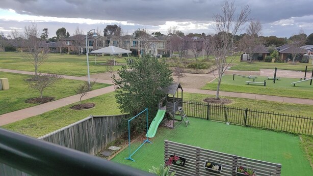 A residential area with a playground, a fenced yard, and houses in the background. - 3B parkview Sancatury Lake house for 6people &Wifi&Lake&golf&SPA (Point Cook)