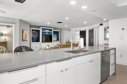 Pink Pineapple ~ Walk to Downtown ~ Chic Heated Pool Home