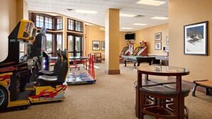 A room with a pool table, a dartboard, and a gaming table. - SKI-IN, SKI-OUT Breckenridge Bliss, 1-BR Luxury Resort w/Hot Tubs, Pool, Theater (Breckenridge)