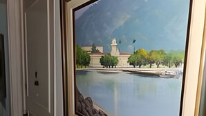 A framed painting of a calm river with a building and trees in the background. - 3 Minutos da Praia - Prime Location (Rio de Janeiro)