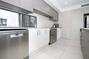 Fridge, microwave, oven, stovetop - Stunning Maroochy Waterfront Home (Sunshine Coast)