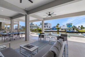 Outdoor dining - 261/265 Canal Estates: 12BR, Pools & Spas, Water Views (Fort Myers Beach)