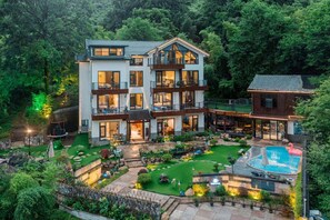 A multi-story house with a large garden, a swimming pool, and a trampoline. - Shenshan Wild Escape (Huzhou)