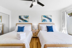Bedroom 2: Double Queen Comfort. Featuring two plush Queen beds, this bright room is perfect for families or friends traveling together. - Pacific Beach Escape | Ocean Views • Close to All Things Beachy (San Diego)