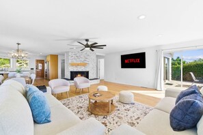 Wind down after a day at the beach with a movie on the large wall-mounted Smart TV (featuring Netflix and other streaming apps). - Pacific Beach Escape | Ocean Views • Close to All Things Beachy (San Diego)