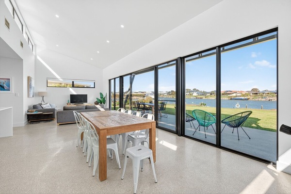 Flooded with natural light, this relaxed zone connects seamlessly to the outdoors through oversized industrial doors.