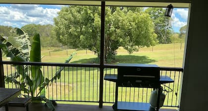 Just off the highway , 2 kilometres to town but still in the country.