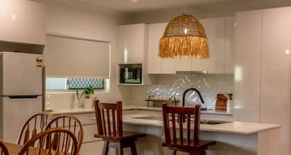 Just off the highway , 2 kilometres to town but still in the country.