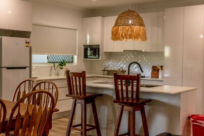 Just off the highway , 2 kilometres to town but still in the country.