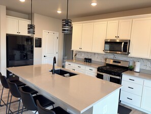 Microwave, oven, stovetop, dishwasher - Modern 4-bedroom house in Quiet Brighton, Near Major Highways & DIA (Brighton)