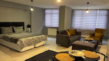 Ático Deluxe, vistas a la ciudad | Zona de estar