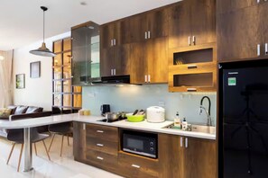 Grand Suite, 1 Bedroom, Club Lounge Access, City View | Private kitchen | Full-size fridge, microwave, oven, stovetop - Odela Luxstay Golden Mansion Residence (Phu Nhuan)