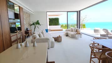 Two-Bedroom Oceanfront Pool Villa | Living area | 160-inch LED TV with cable channels, Netflix, streaming services